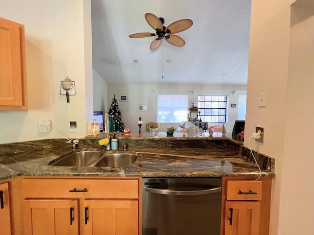 kitchen with kitchen peninsula, ceiling fan, a textured ceiling, and dishwasher