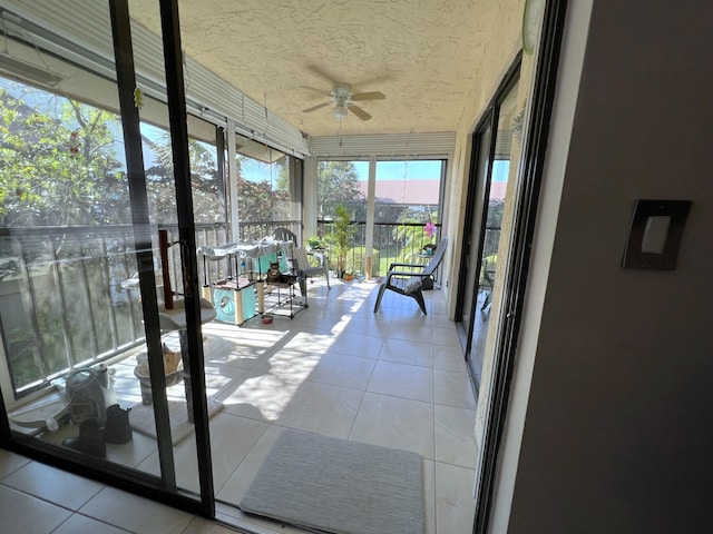 sunroom / solarium with ceiling fan