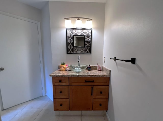 bathroom with tile patterned flooring and vanity