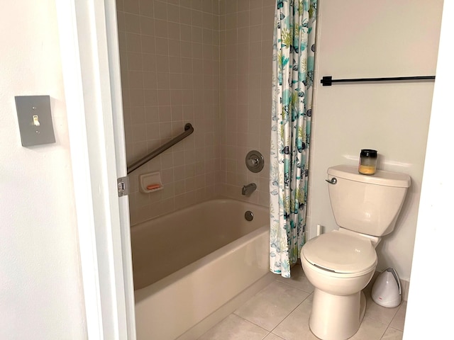 bathroom with shower / bath combo, toilet, and tile patterned floors