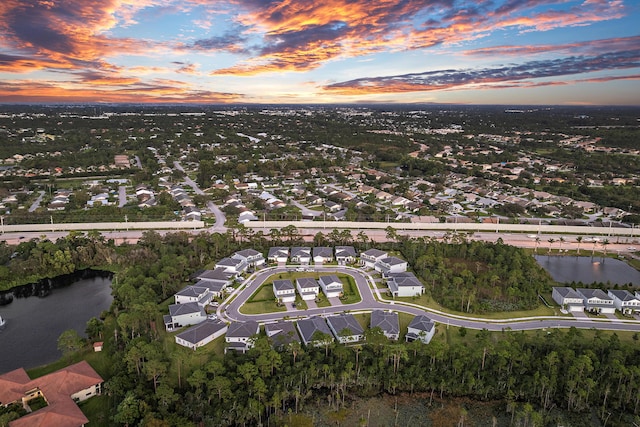 200 SW Pomeroy St, Stuart, FL 34997 - aerial view of property and surrounding area with a large body of water and nearby suburban area
