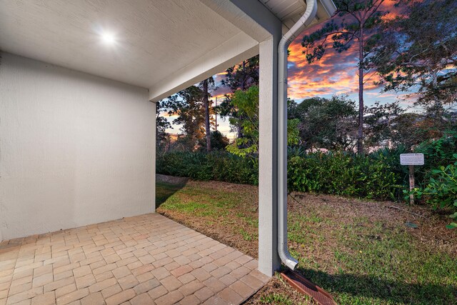 view of patio terrace at dusk