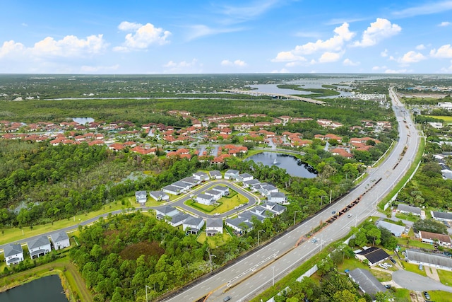 200 SW Pomeroy St, Stuart, FL 34997 - aerial view of property's location featuring a nearby body of water, a major roadway, and nearby suburban area