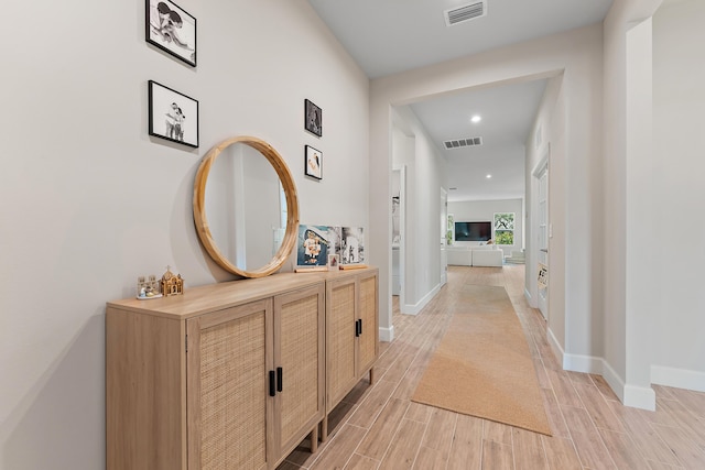 200 SW Pomeroy St, Stuart, FL 34997 - corridor with recessed lighting, light wood-type flooring, and baseboards
