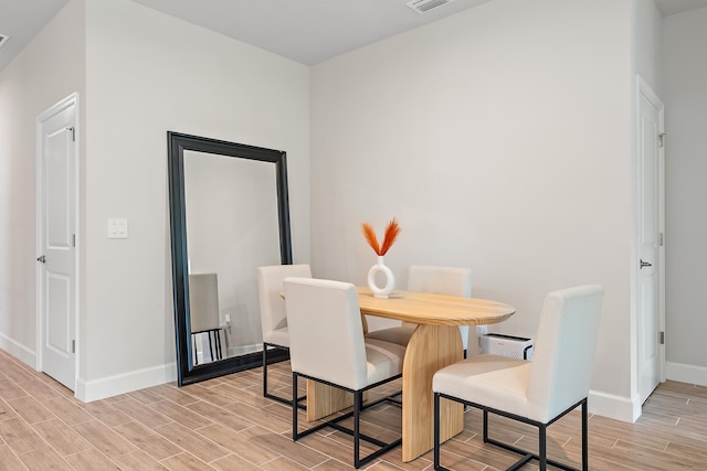 dining room featuring light hardwood / wood-style floors