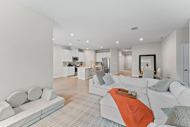 200 SW Pomeroy St, Stuart, FL 34997 - living area with recessed lighting and baseboards