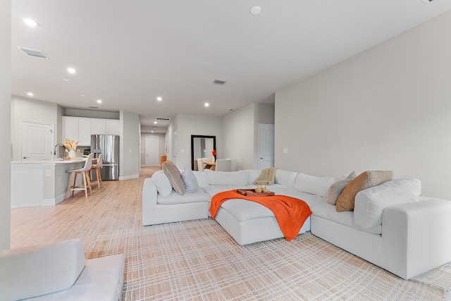 living room featuring light wood-type flooring