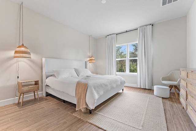 bedroom with light wood-type flooring