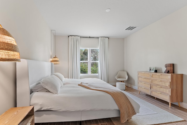 bedroom with wood-type flooring