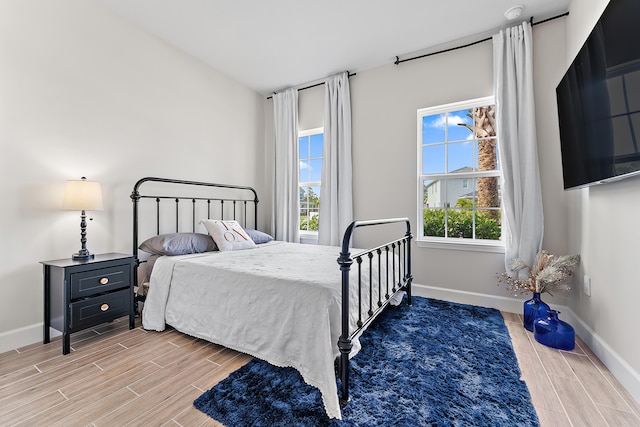 bedroom with wood-type flooring