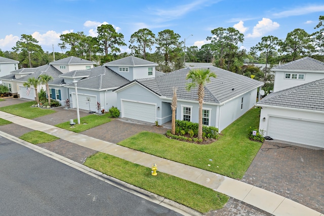 front facade with a front lawn and a garage