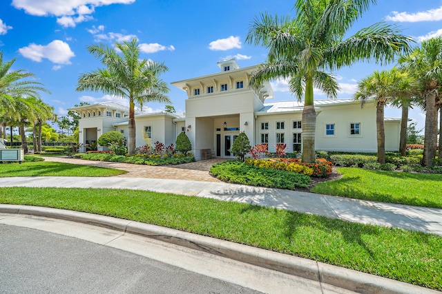 view of front of property with a front lawn and french doors