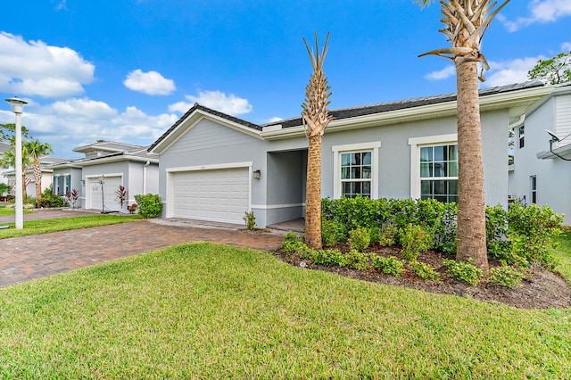 single story home with a garage and a front yard