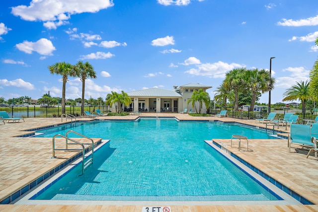 view of swimming pool featuring a patio area