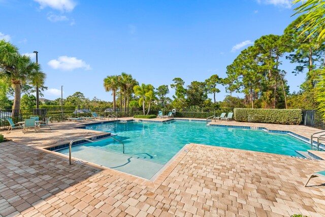200 SW Pomeroy St, Stuart, FL 34997 - community pool featuring a patio area