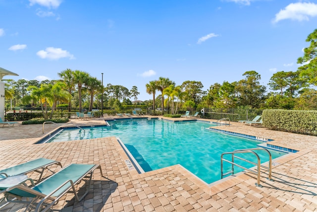 view of swimming pool featuring a patio area