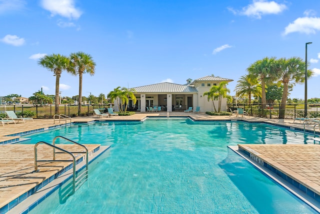 view of swimming pool featuring a patio area