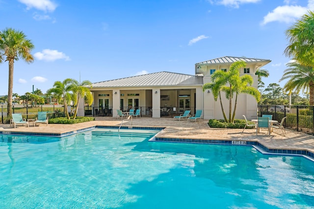 200 SW Pomeroy St, Stuart, FL 34997 - community pool featuring french doors and a patio