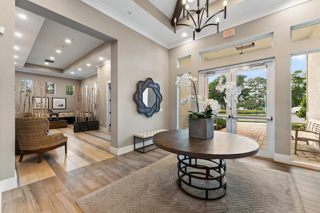 200 SW Pomeroy St, Stuart, FL 34997 - dining area with wood finished floors, baseboards, french doors, recessed lighting, and a towering ceiling