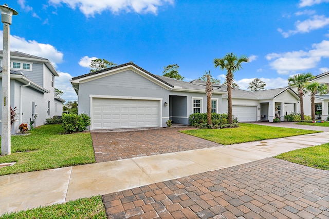 view of front of house with a garage and a front yard