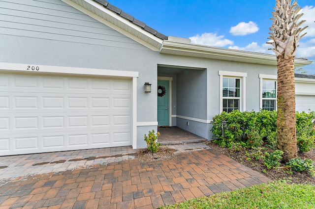 property entrance featuring a garage