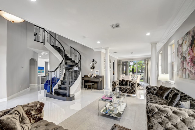 tiled living room with decorative columns and ornamental molding