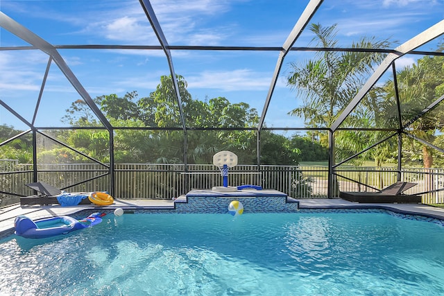 view of swimming pool with a lanai and a patio