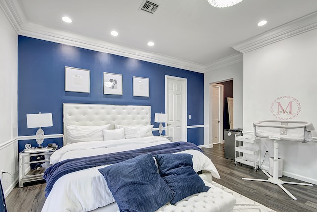 bedroom featuring dark hardwood / wood-style flooring and crown molding