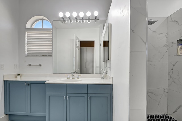 bathroom featuring vanity and tiled shower