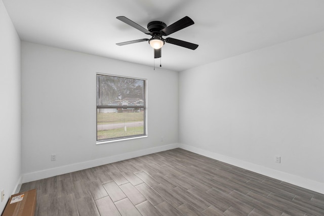 empty room featuring hardwood / wood-style flooring and ceiling fan