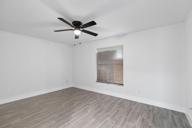 unfurnished room with light wood-type flooring and ceiling fan