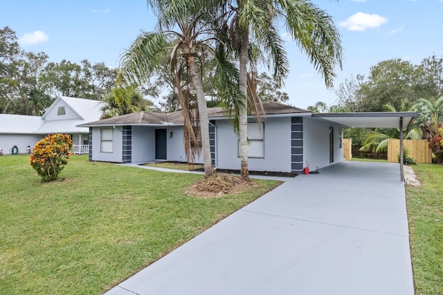 view of front facade featuring a carport and a front lawn