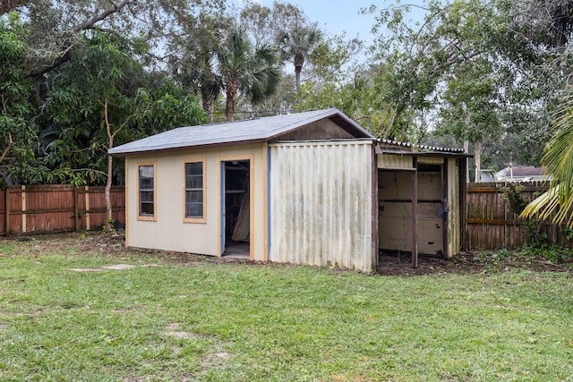 view of outdoor structure featuring a lawn