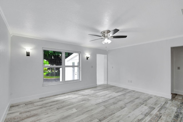 empty room with ceiling fan, a textured ceiling, ornamental molding, and light hardwood / wood-style flooring