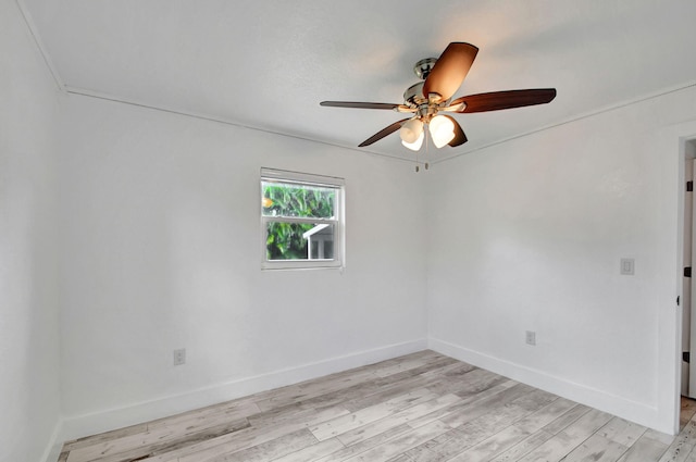 spare room with light hardwood / wood-style floors and ceiling fan