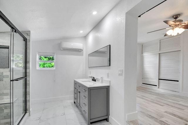 bathroom featuring vanity, an enclosed shower, a wall unit AC, and hardwood / wood-style floors