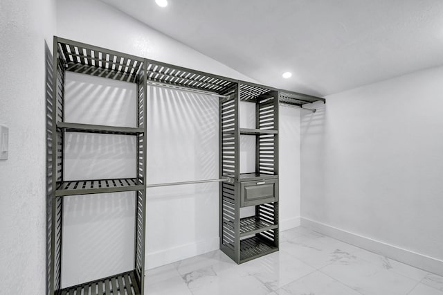 spacious closet featuring vaulted ceiling