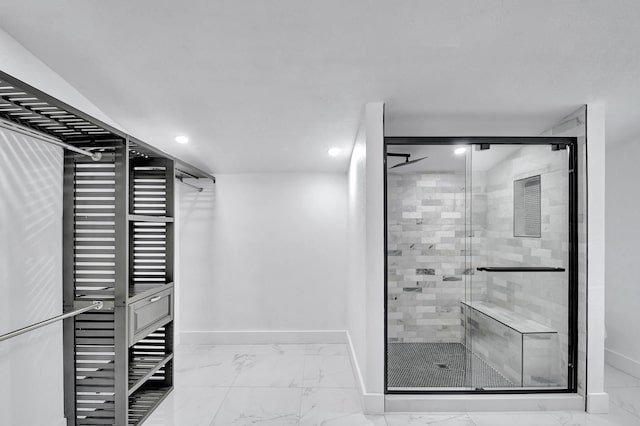 bathroom with a shower with shower door