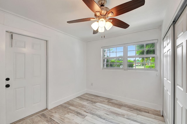 unfurnished bedroom with light hardwood / wood-style floors and ceiling fan