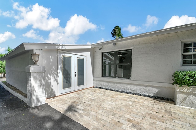 rear view of house with french doors and a patio area