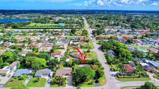 birds eye view of property featuring a water view