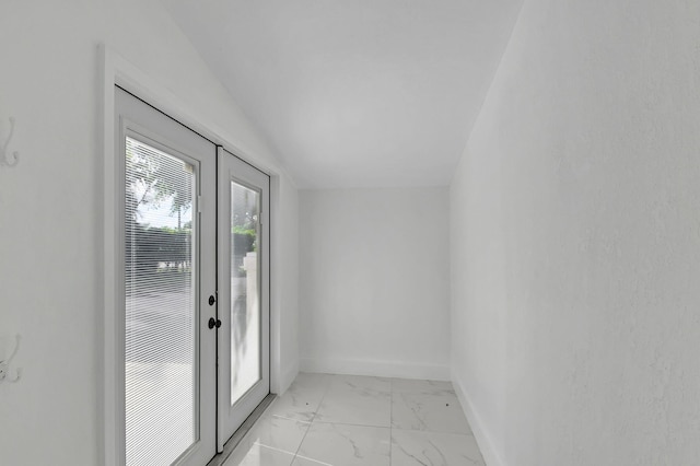 doorway with lofted ceiling