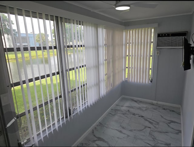 sunroom with a water view and a wall mounted air conditioner