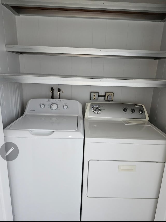 clothes washing area featuring laundry area and independent washer and dryer