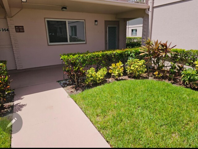 property entrance featuring stucco siding