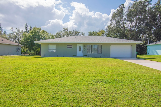 single story home featuring a garage and a front yard