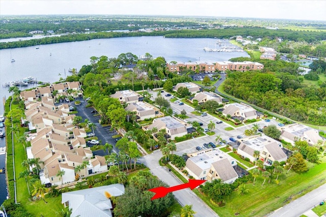 birds eye view of property with a water view