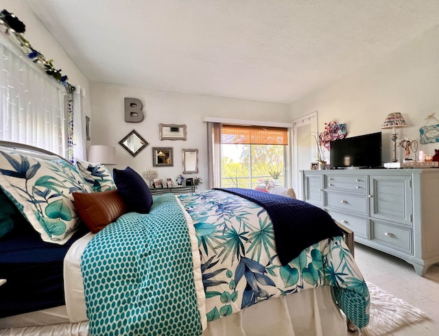 bedroom featuring a textured ceiling