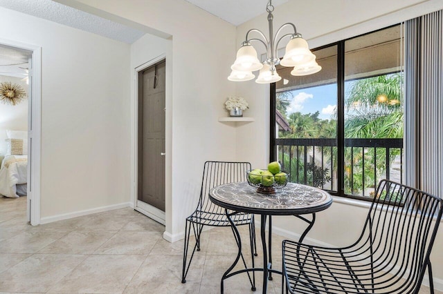 dining area with a chandelier and light tile patterned floors