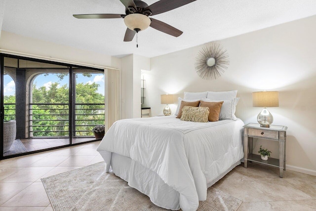 tiled bedroom featuring ceiling fan and access to outside